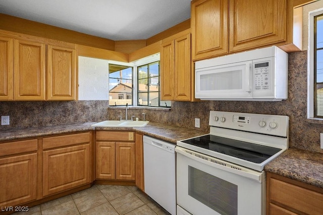 633 5th St, Boulder City, NV 89005 - kitchen featuring white appliances, a sink, decorative backsplash, dark countertops, and light tile patterned flooring