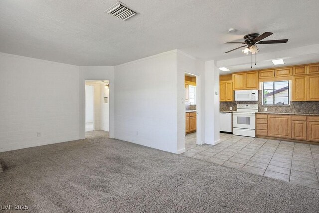 633 5th St, Boulder City, NV 89005 - kitchen with white appliances, ceiling fan, light carpet, backsplash, and a textured ceiling