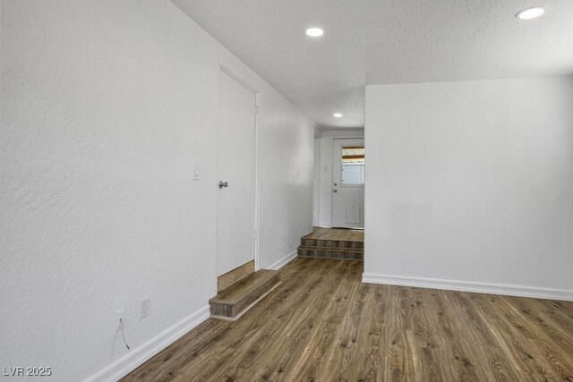 633 5th St, Boulder City, NV 89005 - spare room featuring wood finished floors, baseboards, recessed lighting, and a textured ceiling