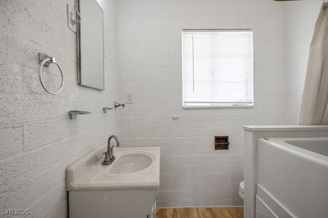 633 5th St, Boulder City, NV 89005 - full bath with vanity, toilet, and wood finished floors