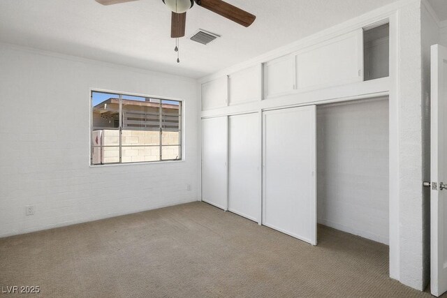 633 5th St, Boulder City, NV 89005 - unfurnished bedroom featuring carpet floors, a closet, crown molding, and ceiling fan