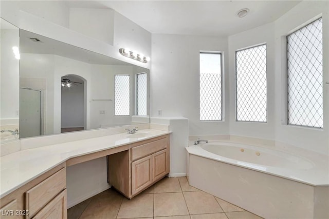 5341 Cool Dawn Ct, Las Vegas, NV 89130 - bathroom with plenty of natural light, tile patterned floors, vanity, and a garden tub