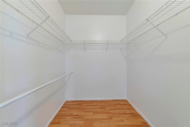 5341 Cool Dawn Ct, Las Vegas, NV 89130 - spacious closet featuring light wood-style floors