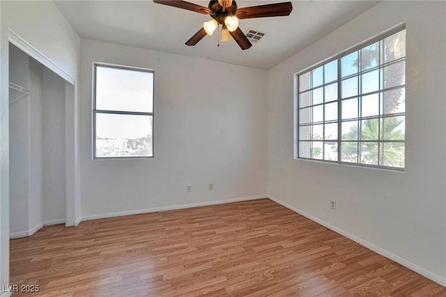 5341 Cool Dawn Ct, Las Vegas, NV 89130 - unfurnished bedroom with light wood finished floors, baseboards, a closet, and a ceiling fan