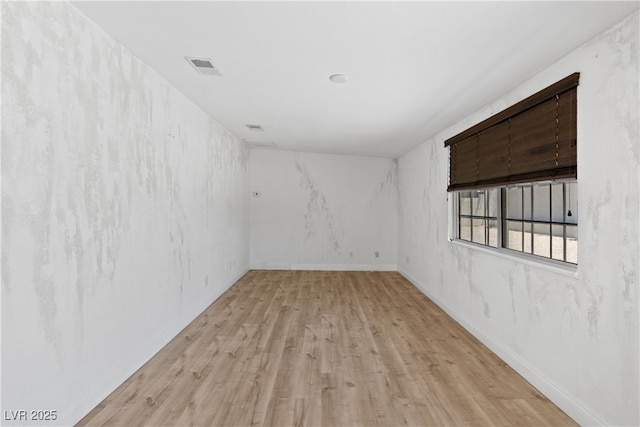1655 E Hacienda Ave, Las Vegas, NV 89119 - spare room featuring light wood finished floors and baseboards