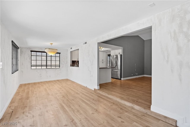 1655 E Hacienda Ave, Las Vegas, NV 89119 - empty room featuring light wood finished floors and baseboards