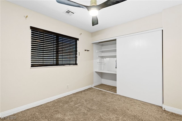 1655 E Hacienda Ave, Las Vegas, NV 89119 - unfurnished bedroom featuring carpet, a closet, baseboards, and a ceiling fan