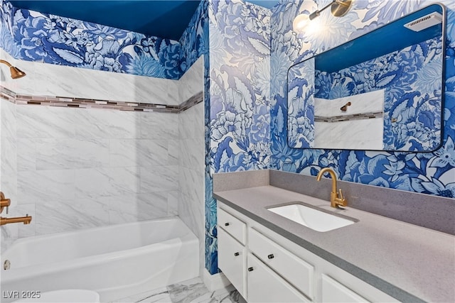 1655 E Hacienda Ave, Las Vegas, NV 89119 - bathroom featuring wallpapered walls, marble finish flooring, vanity, and bathtub / shower combination