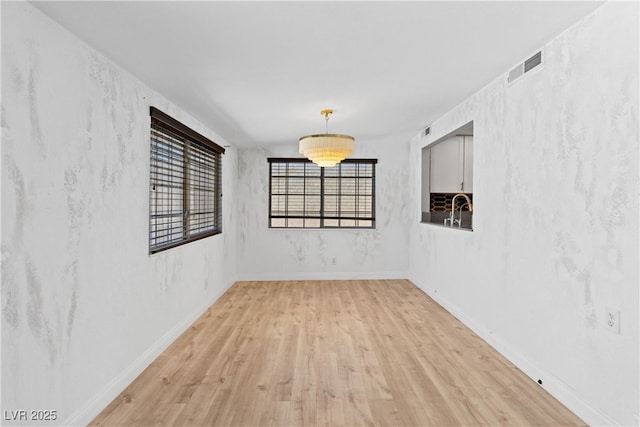 1655 E Hacienda Ave, Las Vegas, NV 89119 - unfurnished room with light wood-style floors and baseboards