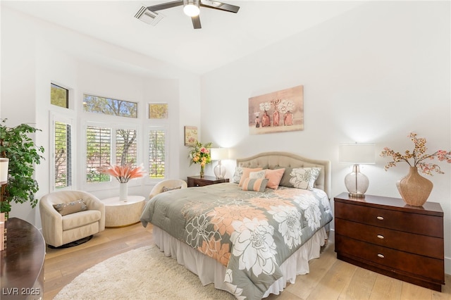 10404 Long Leaf Pl, Las Vegas, NV 89134 - bedroom featuring hardwood / wood-style flooring, a high ceiling, and a ceiling fan