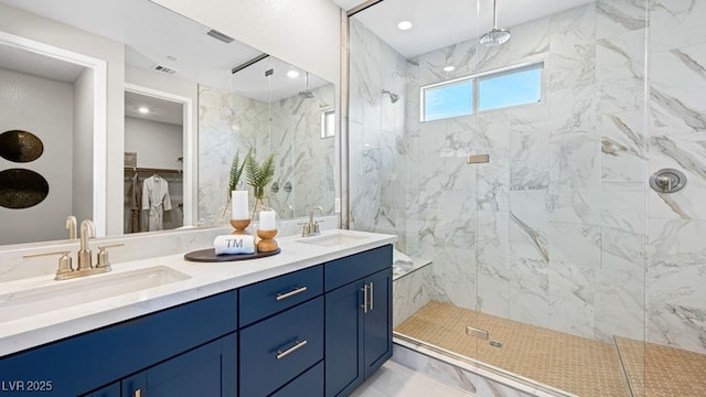 338 Taylor St, Henderson, NV 89015 - full bathroom with a marble finish shower, marble finish flooring, double vanity, and a walk in closet