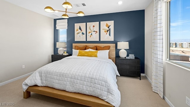338 Taylor St, Henderson, NV 89015 - carpeted bedroom featuring multiple windows, baseboards, and a chandelier