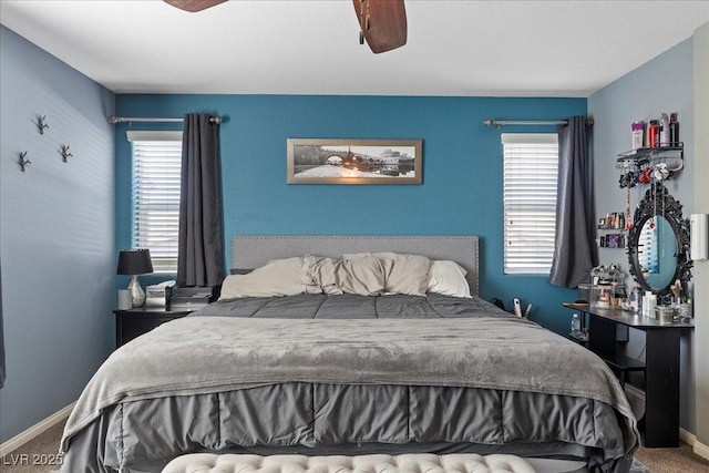 6857 Stone Tower Ct, Las Vegas, NV 89149 - carpeted bedroom with multiple windows, baseboards, and a ceiling fan