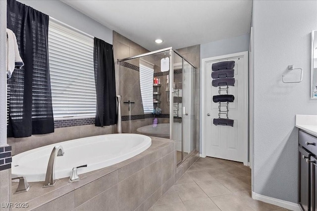 6857 Stone Tower Ct, Las Vegas, NV 89149 - bathroom featuring a garden tub, tile patterned flooring, vanity, and a shower stall
