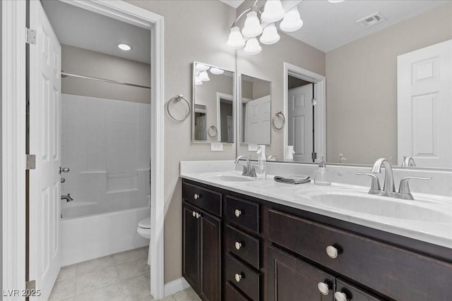6857 Stone Tower Ct, Las Vegas, NV 89149 - bathroom featuring a chandelier, toilet, double vanity, and tub / shower combination