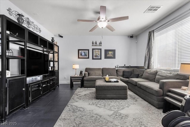 6857 Stone Tower Ct, Las Vegas, NV 89149 - living room featuring ceiling fan and baseboards