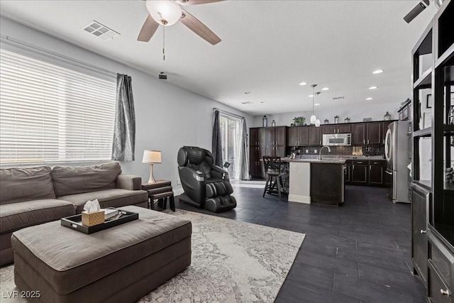 6857 Stone Tower Ct, Las Vegas, NV 89149 - living area featuring ceiling fan and recessed lighting