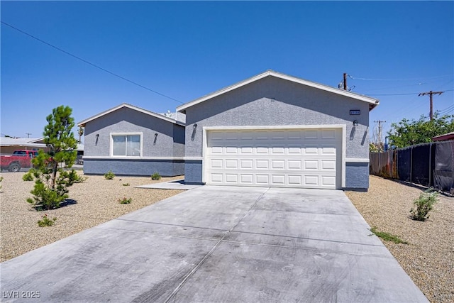 2130 Revere St, North Las Vegas, NV 89030 - ranch-style house with driveway, an attached garage, and stucco siding
