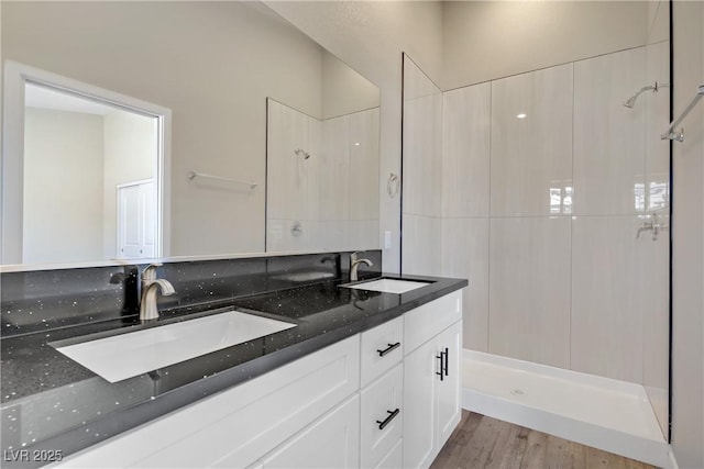 2130 Revere St, North Las Vegas, NV 89030 - bathroom with double vanity, a shower, and wood finished floors
