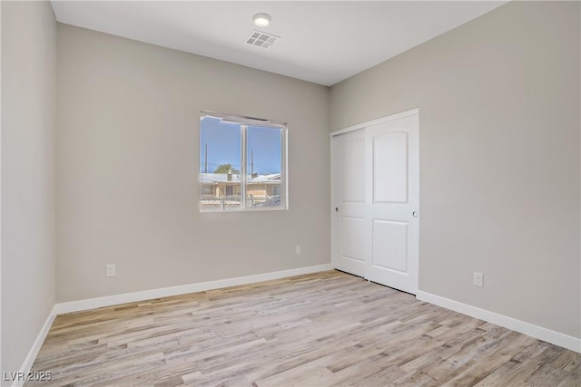 2130 Revere St, North Las Vegas, NV 89030 - unfurnished bedroom featuring light wood-style floors and baseboards