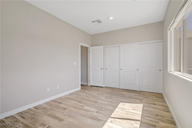 2130 Revere St, North Las Vegas, NV 89030 - unfurnished bedroom featuring light wood-style floors, a closet, and recessed lighting