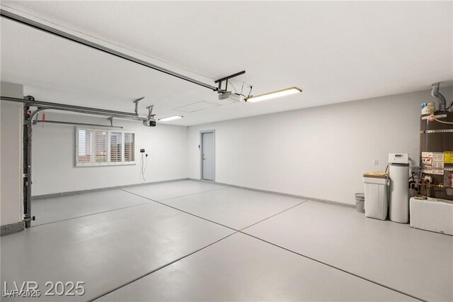 1613 Shadow Rock Dr, Las Vegas, NV 89117 - garage featuring water heater and a garage door opener