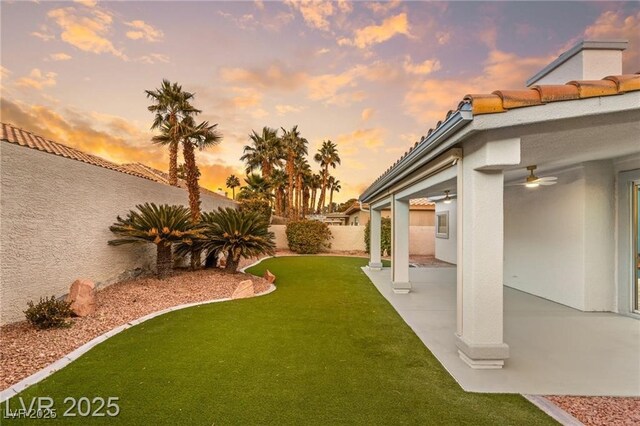 1613 Shadow Rock Dr, Las Vegas, NV 89117 - view of yard with ceiling fan and a patio area