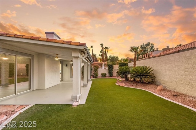 1613 Shadow Rock Dr, Las Vegas, NV 89117 - yard at dusk featuring a patio area