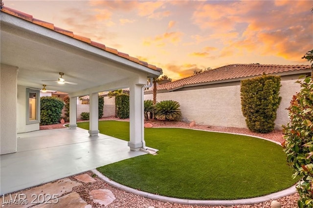 1613 Shadow Rock Dr, Las Vegas, NV 89117 - view of grassy yard with ceiling fan and a patio