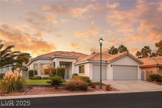 1613 Shadow Rock Dr, Las Vegas, NV 89117 - mediterranean / spanish-style house with a garage, stucco siding, driveway, and a tile roof