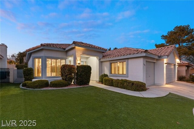 1613 Shadow Rock Dr, Las Vegas, NV 89117 - mediterranean / spanish-style house with a tiled roof, a garage, concrete driveway, and stucco siding