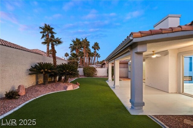 1613 Shadow Rock Dr, Las Vegas, NV 89117 - view of yard featuring a ceiling fan and a patio