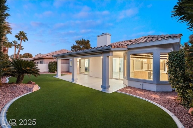 1613 Shadow Rock Dr, Las Vegas, NV 89117 - rear view of house with a tiled roof, a patio, a chimney, and stucco siding