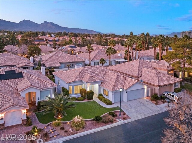 1613 Shadow Rock Dr, Las Vegas, NV 89117 - view of front facade with a garage, concrete driveway, a residential view, and a front lawn