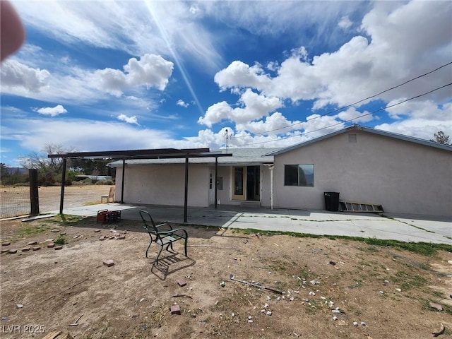 781 Buol Rd, Pahrump, NV 89048 - back of house with stucco siding and a patio