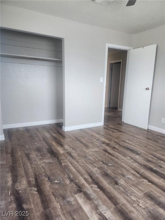 781 Buol Rd, Pahrump, NV 89048 - unfurnished bedroom featuring wood finished floors, baseboards, and a closet