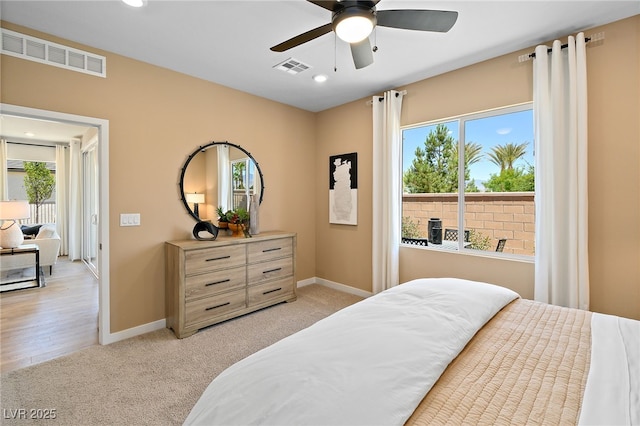 4180 E Brusca Way, Pahrump, NV 89061 - bedroom featuring light colored carpet, multiple windows, and recessed lighting