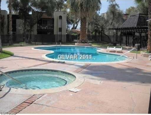 1405 Vegas Valley Dr Unit 378, Las Vegas, NV 89169 - community pool with a hot tub and a patio