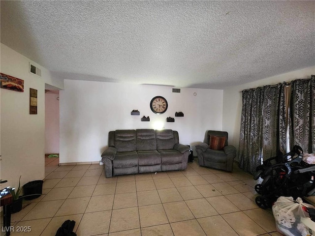 1405 Vegas Valley Dr Unit 378, Las Vegas, NV 89169 - living room featuring a textured ceiling and light tile patterned floors