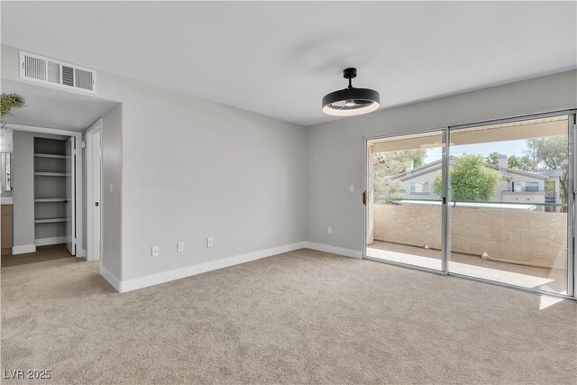 5710 E Tropicana Ave Unit 2152, Las Vegas, NV 89122 - carpeted spare room featuring baseboards