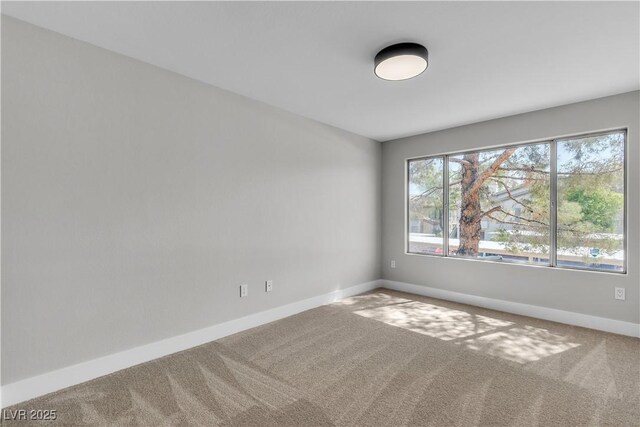 5710 E Tropicana Ave Unit 2152, Las Vegas, NV 89122 - carpeted empty room with baseboards
