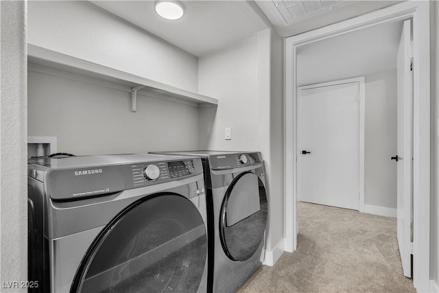 5710 E Tropicana Ave Unit 2152, Las Vegas, NV 89122 - laundry room with washing machine and dryer, carpet floors, and baseboards