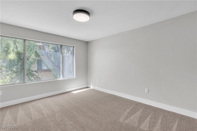 5710 E Tropicana Ave Unit 2152, Las Vegas, NV 89122 - empty room with carpet flooring and baseboards