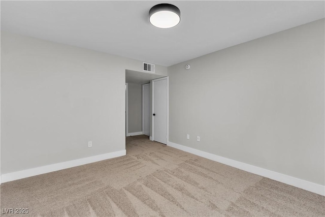 5710 E Tropicana Ave Unit 2152, Las Vegas, NV 89122 - empty room featuring carpet floors and baseboards