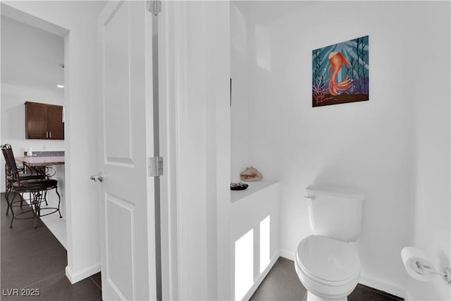 8178 Eaton Hill St, Las Vegas, NV 89113 - bathroom featuring toilet and baseboards