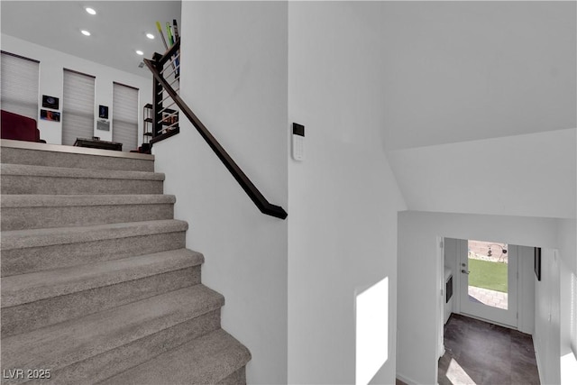8178 Eaton Hill St, Las Vegas, NV 89113 - staircase featuring recessed lighting, a towering ceiling, and carpet floors