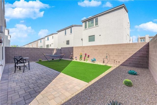 8178 Eaton Hill St, Las Vegas, NV 89113 - fenced backyard featuring a patio area and a residential view