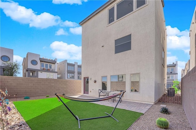8178 Eaton Hill St, Las Vegas, NV 89113 - back of property featuring a fenced backyard, a patio, and stucco siding