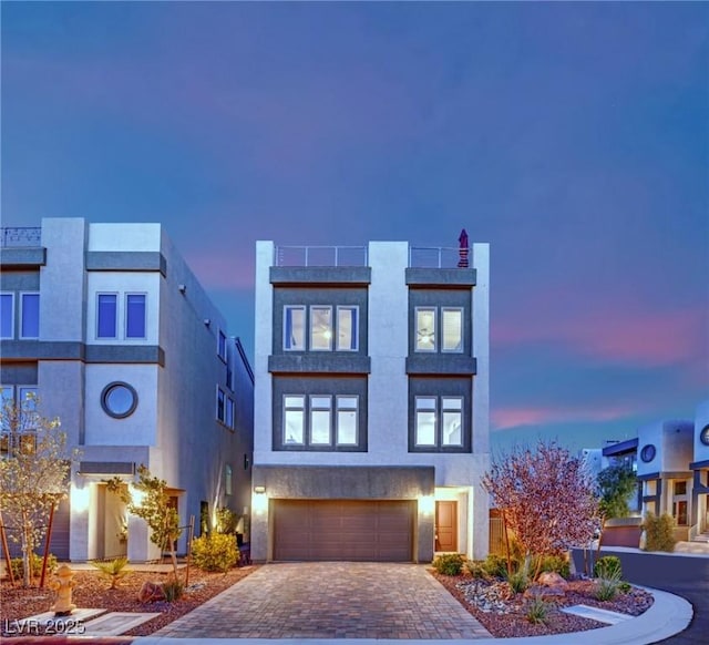 8178 Eaton Hill St, Las Vegas, NV 89113 - view of front facade featuring a garage, decorative driveway, and stucco siding