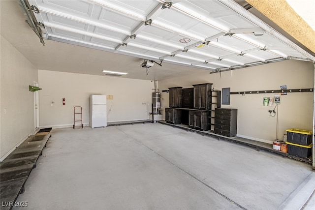 11177 Twilight Times Ct, Las Vegas, NV 89135 - garage with electric panel, a garage door opener, secured water heater, and freestanding refrigerator